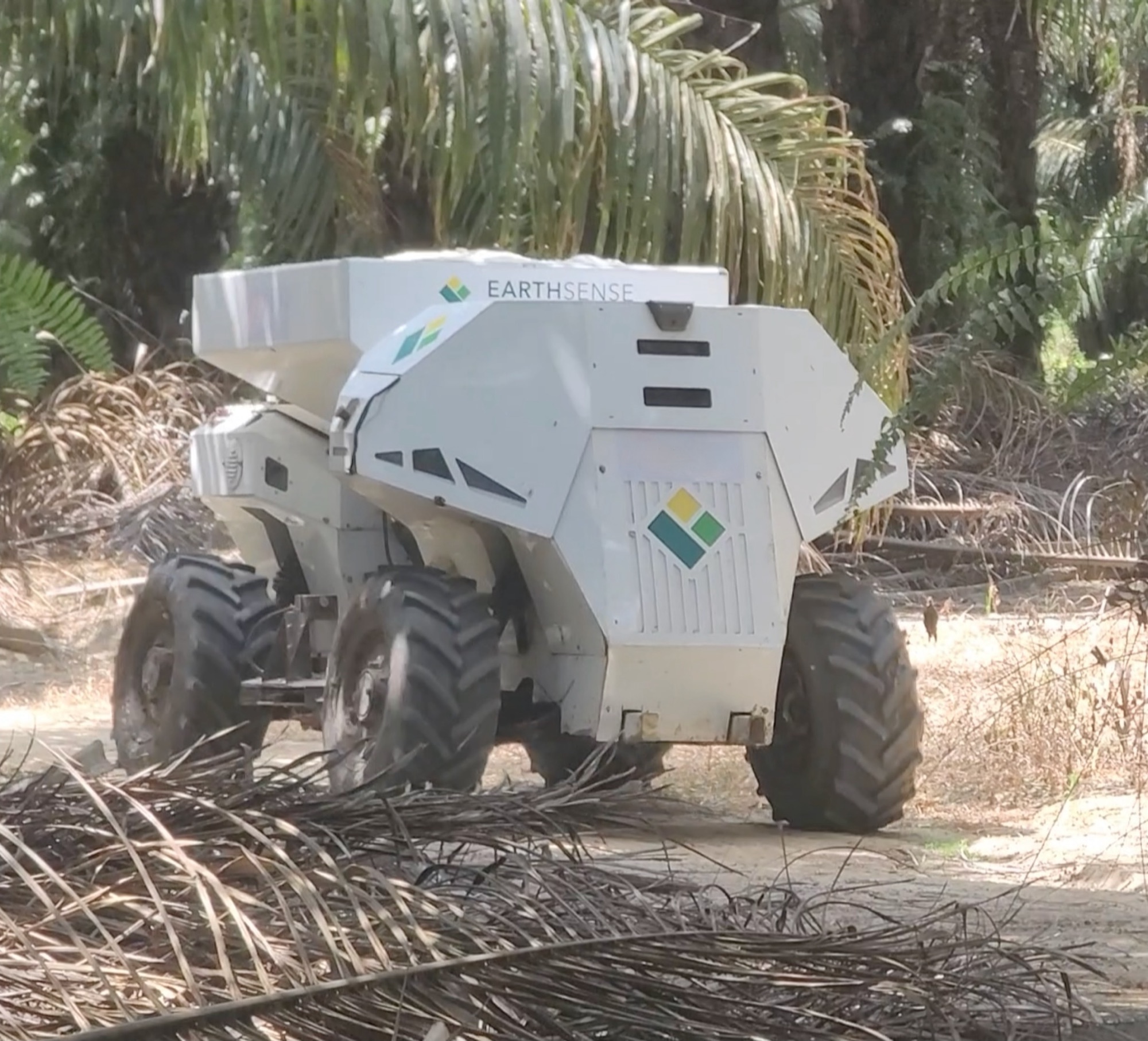 TerraMax and a SmartSpread tractor on a palm estate